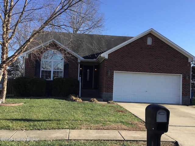 view of front facade with a front yard and a garage