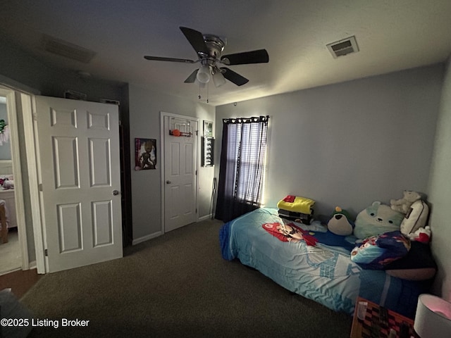 bedroom with ceiling fan and dark colored carpet