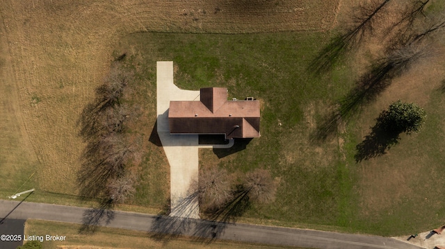 birds eye view of property with a rural view