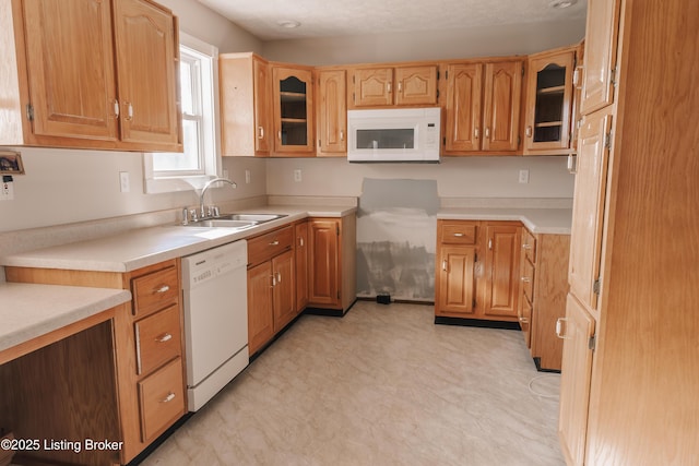 kitchen with sink and white appliances