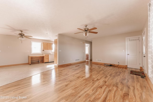 unfurnished living room with ceiling fan and light hardwood / wood-style flooring