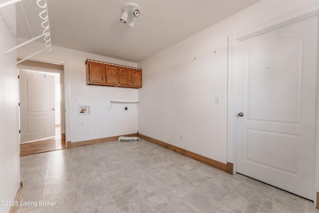 laundry room with hookup for an electric dryer, hookup for a washing machine, and cabinets