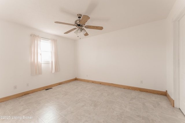 unfurnished room with ceiling fan