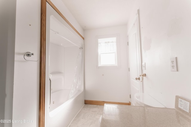 bathroom with tub / shower combination