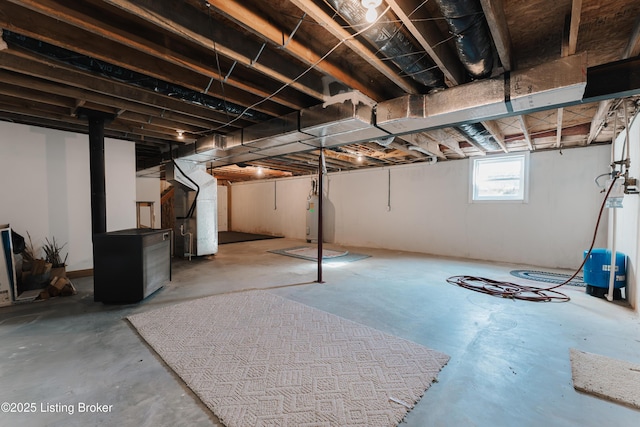 basement with electric water heater and heating unit