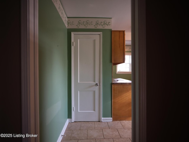 corridor with light tile patterned flooring