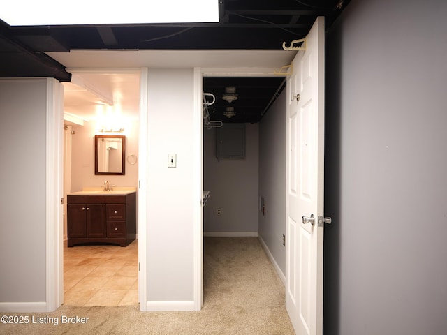 hallway featuring light colored carpet