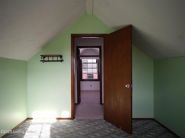 additional living space with carpet, vaulted ceiling, and cooling unit