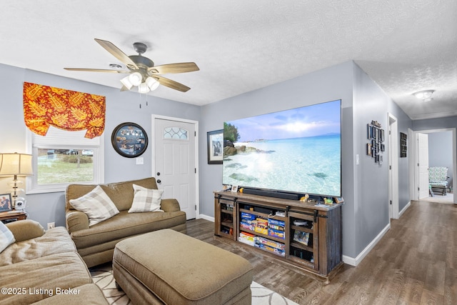 living room featuring hardwood / wood-style floors, a textured ceiling, and ceiling fan