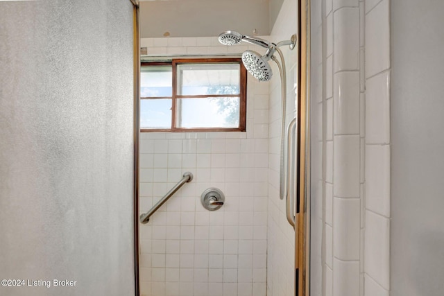 bathroom with a tile shower