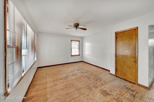 unfurnished room featuring ceiling fan and light hardwood / wood-style floors