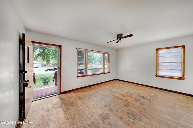 spare room featuring light hardwood / wood-style floors and ceiling fan