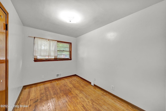 unfurnished room with light wood-type flooring