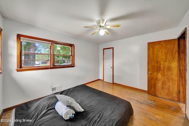 bedroom featuring ceiling fan and light hardwood / wood-style floors