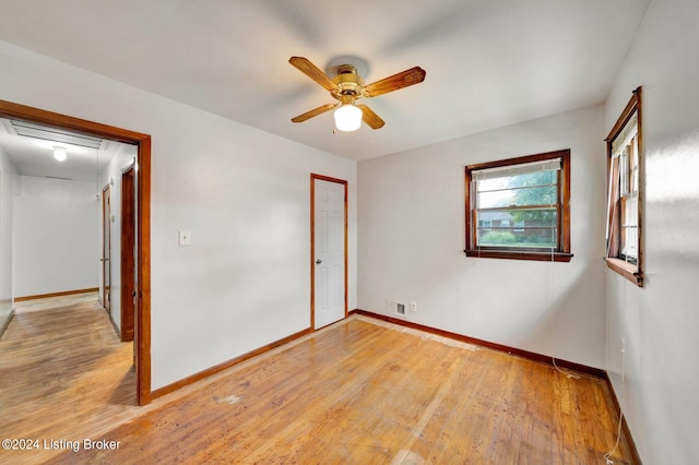 spare room featuring ceiling fan and light hardwood / wood-style floors