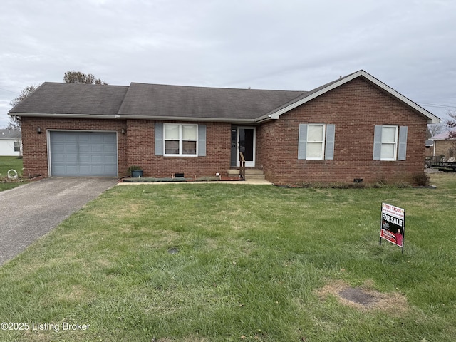 ranch-style home with a front yard and a garage