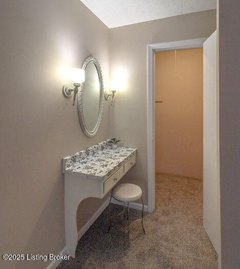 bathroom with a textured ceiling