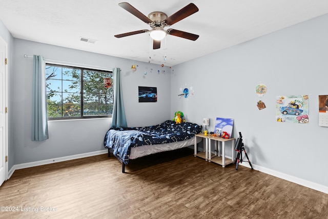 bedroom featuring wood-type flooring and ceiling fan