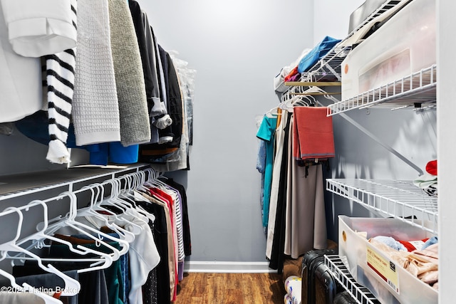 walk in closet featuring dark hardwood / wood-style flooring