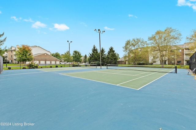 view of tennis court featuring basketball court