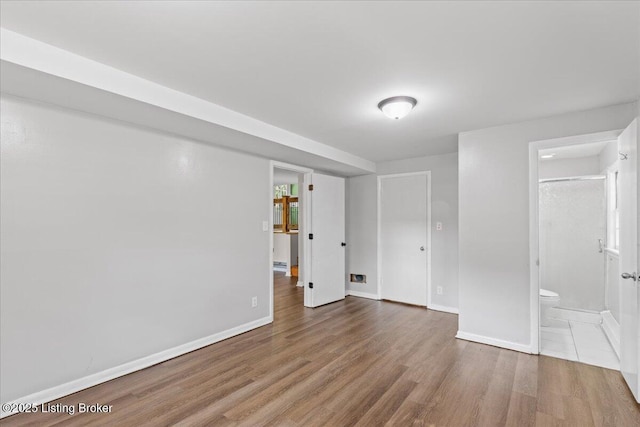 empty room featuring hardwood / wood-style flooring