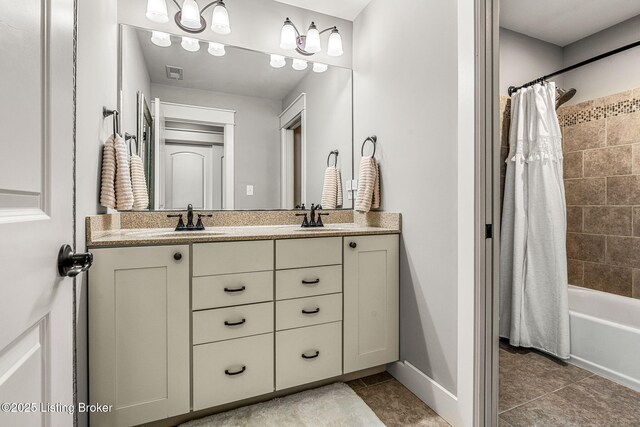 bathroom with tile patterned flooring, shower / tub combo, and vanity