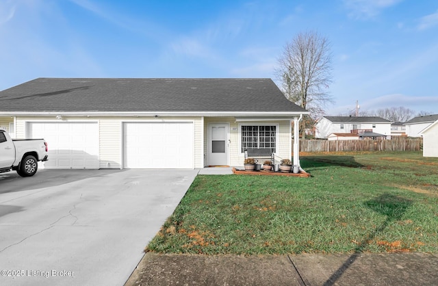 view of front of house featuring a garage and a front lawn