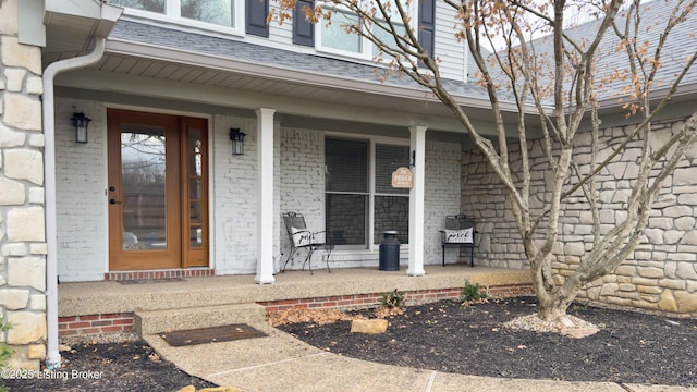 doorway to property featuring covered porch