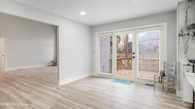 interior space with light hardwood / wood-style floors