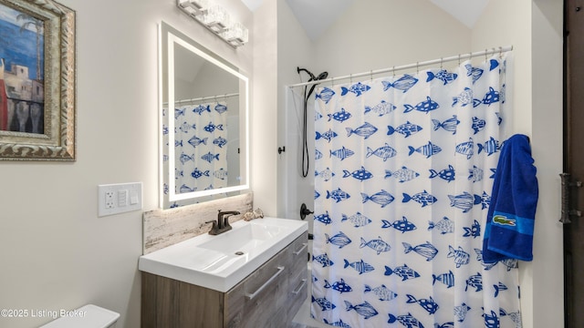 bathroom featuring walk in shower, toilet, vaulted ceiling, vanity, and backsplash