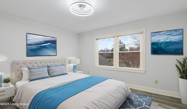 bedroom with hardwood / wood-style floors