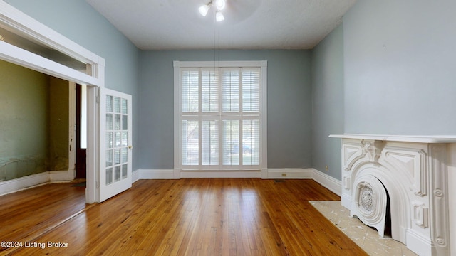 unfurnished living room featuring wood-type flooring