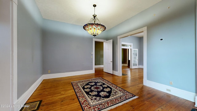 spare room featuring hardwood / wood-style floors