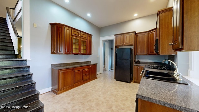 kitchen featuring sink and black appliances