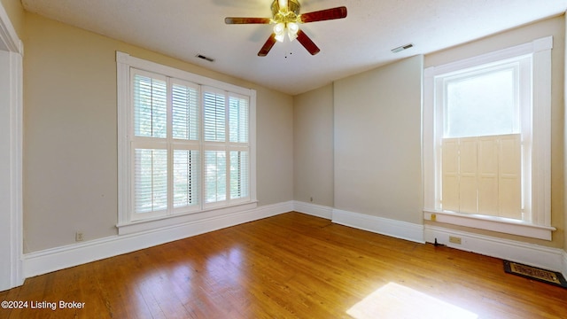 unfurnished room featuring hardwood / wood-style flooring and ceiling fan