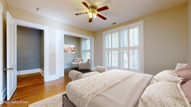 bedroom featuring ceiling fan and wood-type flooring