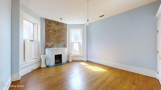 unfurnished living room with hardwood / wood-style floors