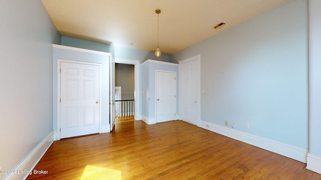 spare room featuring hardwood / wood-style flooring