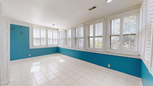 empty room with light tile patterned floors