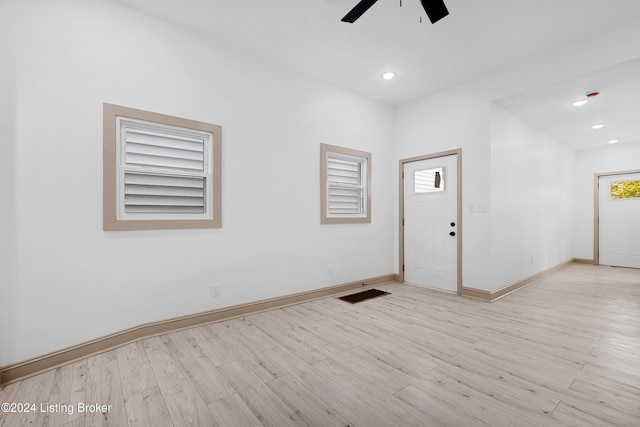 unfurnished room with ceiling fan and light wood-type flooring