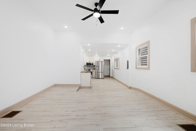 interior space featuring ceiling fan and light hardwood / wood-style floors