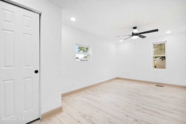 empty room featuring light wood-type flooring and ceiling fan