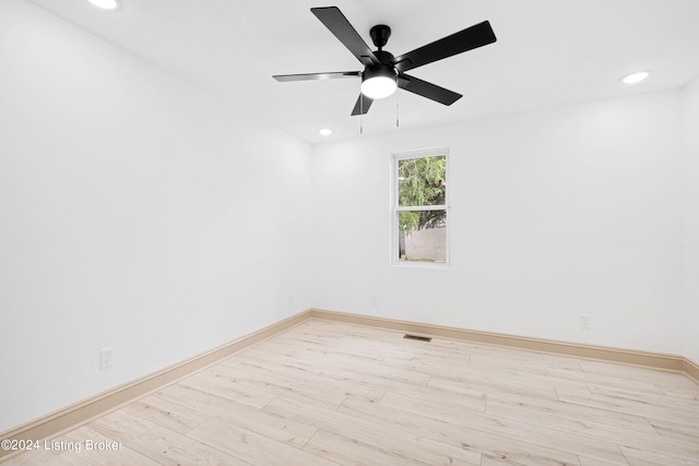 unfurnished room with ceiling fan and light wood-type flooring