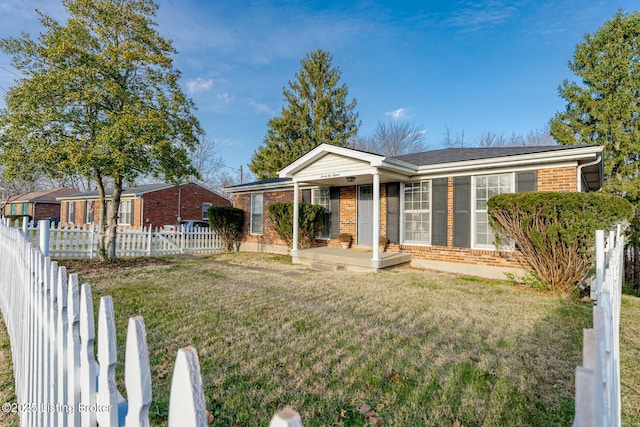 ranch-style home with a front lawn