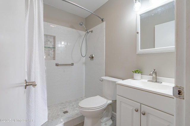 bathroom with vanity, toilet, and curtained shower