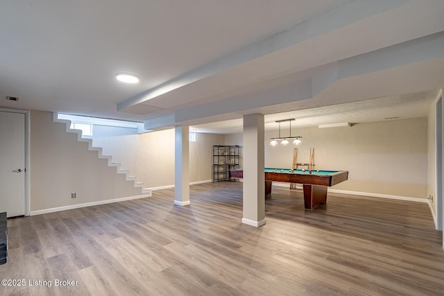 basement with hardwood / wood-style floors and pool table