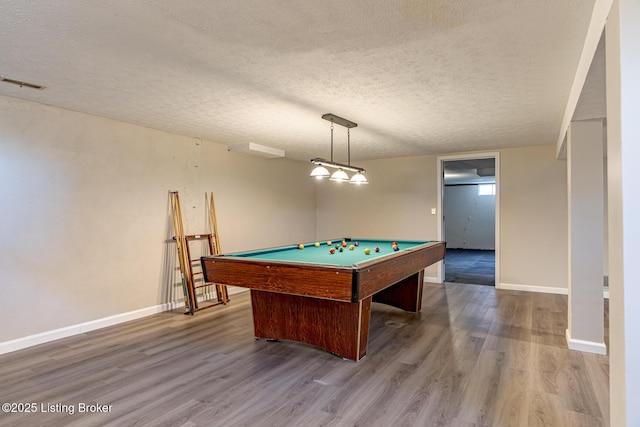 game room with hardwood / wood-style flooring, a textured ceiling, and pool table