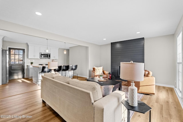 living room with light hardwood / wood-style floors