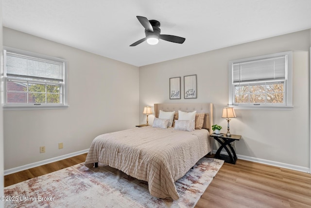 bedroom with light wood-type flooring and ceiling fan