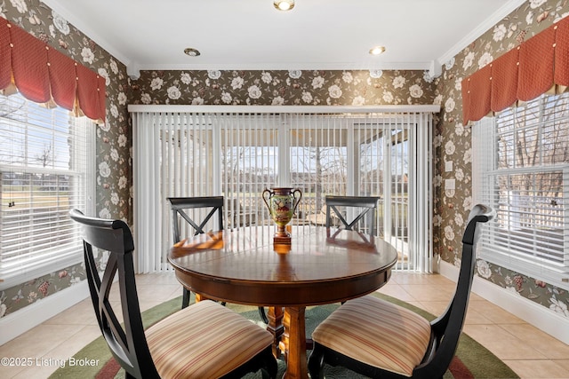 tiled dining area with a wealth of natural light and crown molding